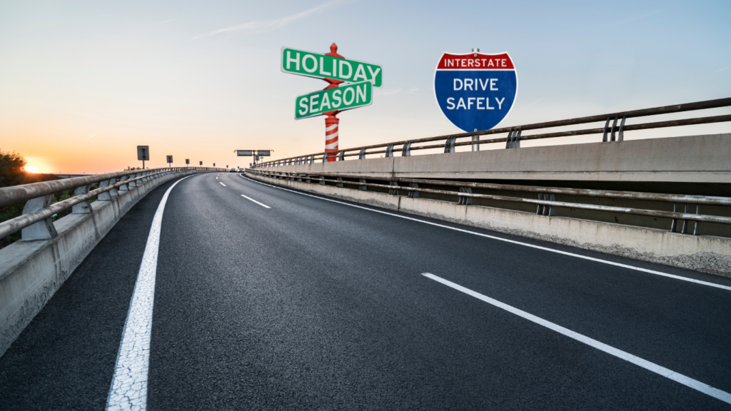 Traffic sign reading 'Drive Safely' and green street sign with the words 'Holiday Season' on the side of the road, emphasizing the importance of road safety during the holiday season.