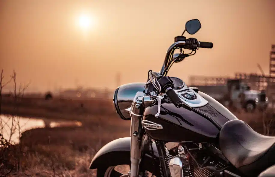 Motorcycle parked outdoors at sunset, illustrating motorcycle safety, protective gear, and injury risks for riders.