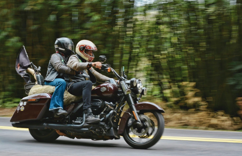 Two motorcyclists riding on a roadway, illustrating the importance of properly maintained motorcycle tires for safe travel.