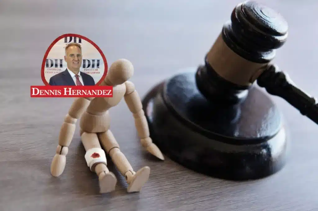 Wooden figure with an injured leg sitting beside a judge’s gavel, with the Dennis Hernandez Injury Attorneys logo overlay.