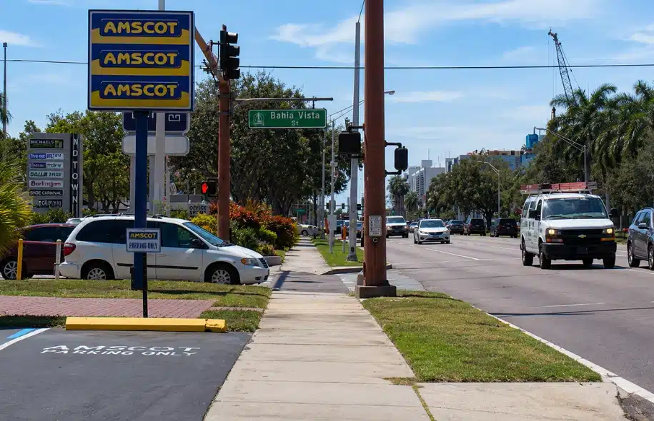 Busy Sarasota roadway near Bahia Vista Street with traffic, sidewalks, and commercial signs.