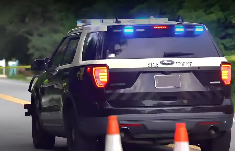 Florida Highway Patrol vehicle with emergency lights activated at the scene of a fatal crash on A1A south of Mickler Road.