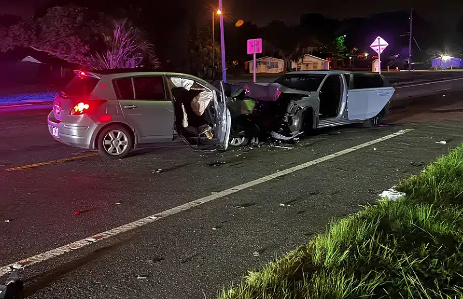 Two heavily damaged vehicles after a nighttime crash on U.S. 17/92 in Davenport, with debris scattered across the roadway.