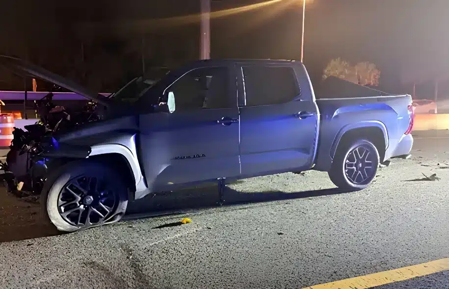 Damaged Toyota Tundra pickup truck after a crash involving an FHP patrol vehicle on State Road 429 in Orange County.